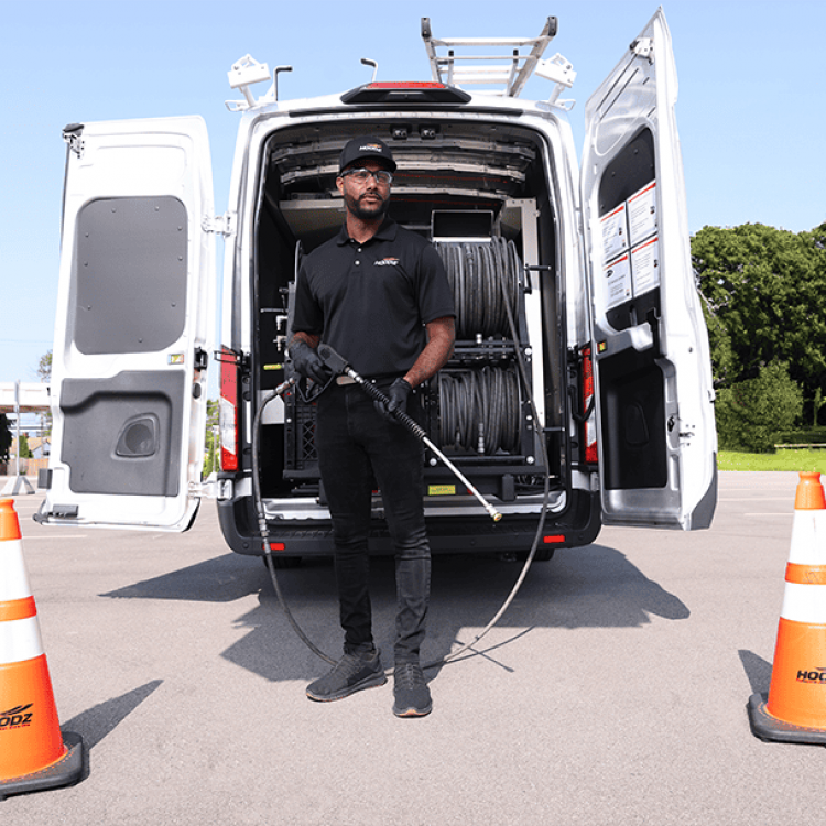 hoodz tech in front of open van