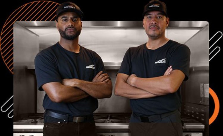 Technicians in front of commercial oven